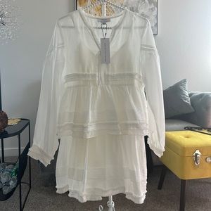 White airy elegant beautiful dress. In reality the size corresponds to XS-S